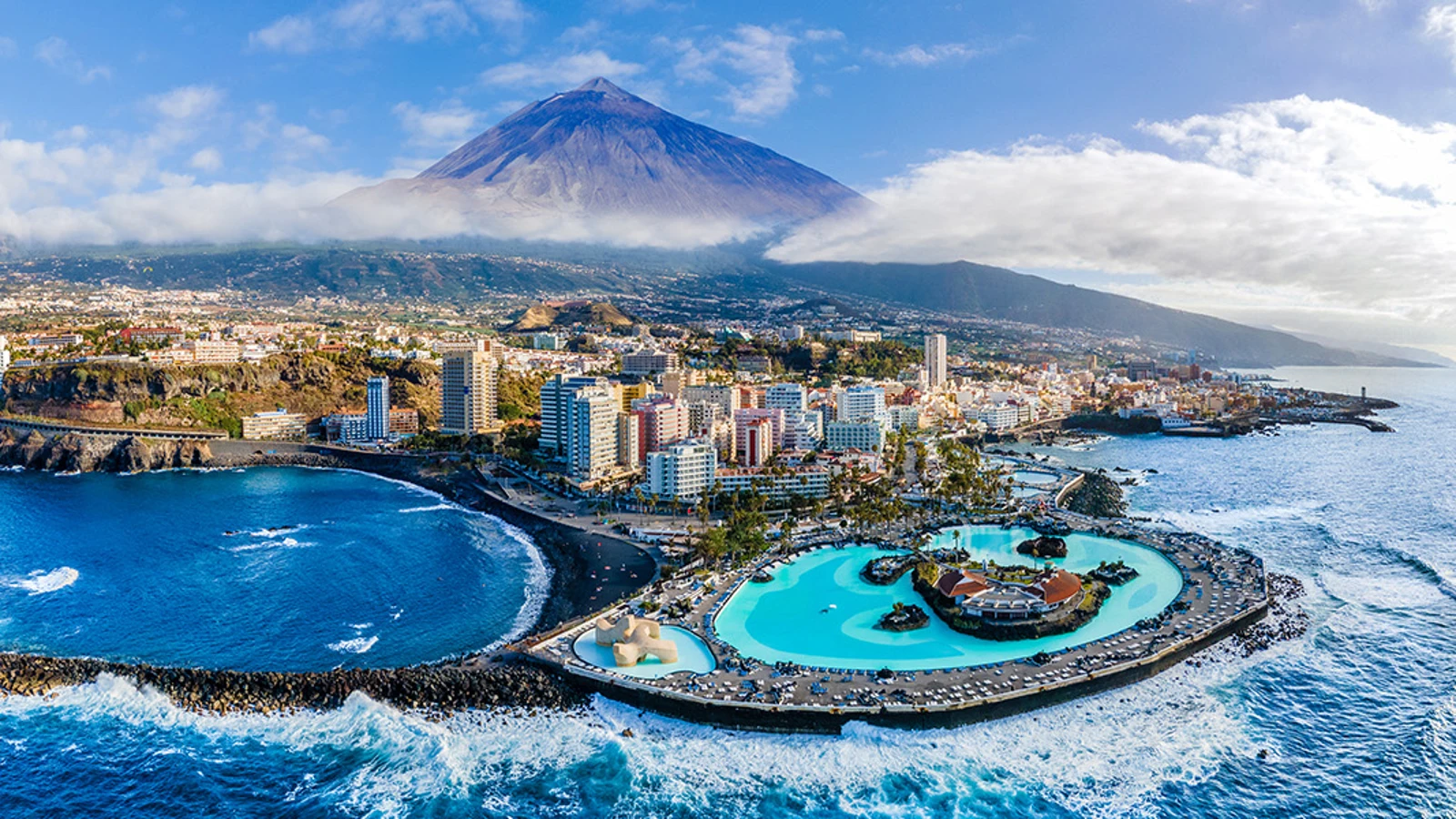 Aerial view of Puerto de la Cruz with Lago Martiánez, Playa Martiánez and Mount Teide